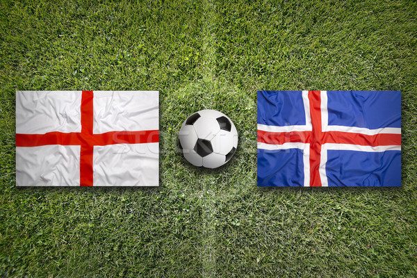 7095868_stock-photo-england-vs-iceland-flags-on-soccer-field