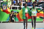 Aug 12, 2016; Rio de Janeiro, Brazil; Almaz Ayana (ETH) and Tirunesh Dibaba (ETH) react after finishing in the women's 10000m final at Estadio Olimpico Joao Havelange during the 2016 Rio Summer Olympic Games. Mandatory Credit: James Lang-USA TODAY Sports