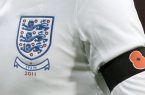 englandplayerwearingblackarmbandwithpoppy2011_large